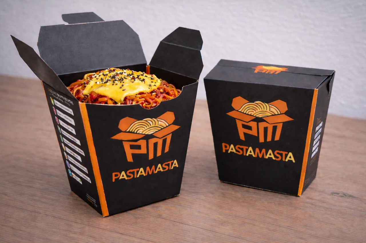 Tall black PASTAMASTA K-popbokki cartons with orange edges